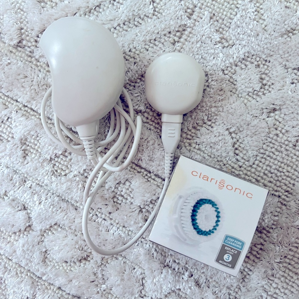 Clarisonic charger (used) and 1 deep pore replacement cleansing brush head (NIB)